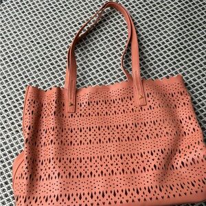 Coral cutout purse/tote.